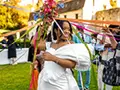 the bride prepares for the bouquet toss